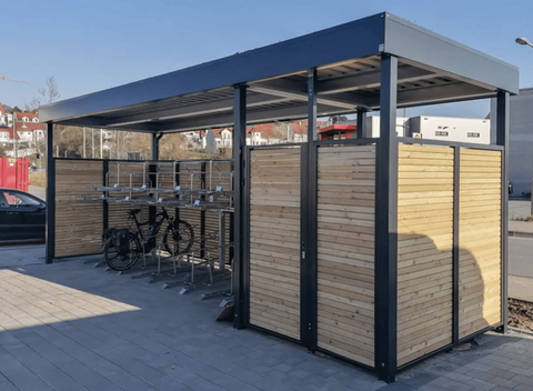 Fahrradunterstand mit Mülltonneneinhausung mit Holzverkleidung von Hacobau